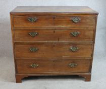 A George III mahogany chest of four long drawers raised on shaped bracket feet. H.91 W.98 D.48cm