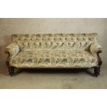 A Victorian mahogany framed deep button back upholstered settee. H.80 W.190 D.70cm.