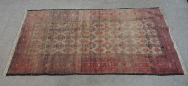 Persian carpet. With black trim running along the sides. W.90 x L.176 cm.