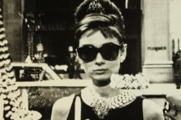 An unframed black and white photograph of Audrey Hepburn. H.80 W.80cm