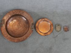 A 20th century hammered copper twin handled alms dish, together with a 20th century, possibly Newlyn
