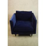 A contemporary blue upholstered angular tub chair. H.83 W,87 D.90cm.