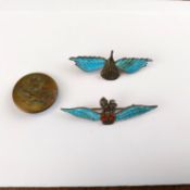 Two silver and enamel parachute regiment badges/brooches and a brass button with an eagle.
