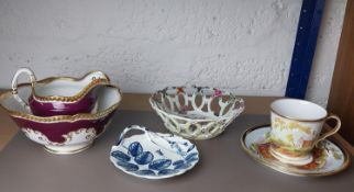 A collection of ceramics, including a hand painted 19th century cup and saucer with landscape design