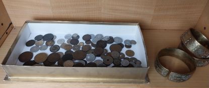 A collection of various coins along with three Indian brass engraved bangles.