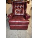 Armchair, leather upholstered with reclining action. H.104 cm.