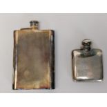 Two lockable silver hip flasks, one with an engine turned design ands the other square. H.15.6 W.10