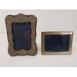 Two silver picture frames. H.12 W.16 cm H.20.5 W.15 cm