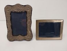 Two silver picture frames. H.12 W.16 cm H.20.5 W.15 cm