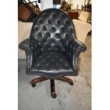 Desk chair, leather upholstered swivel action. H.112 cm.