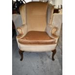 A Mahogany Georgian style wingback armchair. H.112 cm.