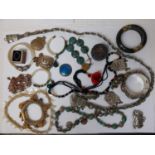 A collection of jewellery, including a carved mother of pearl leaf necklace and various Indian jewel