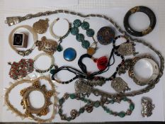 A collection of jewellery, including a carved mother of pearl leaf necklace and various Indian jewel