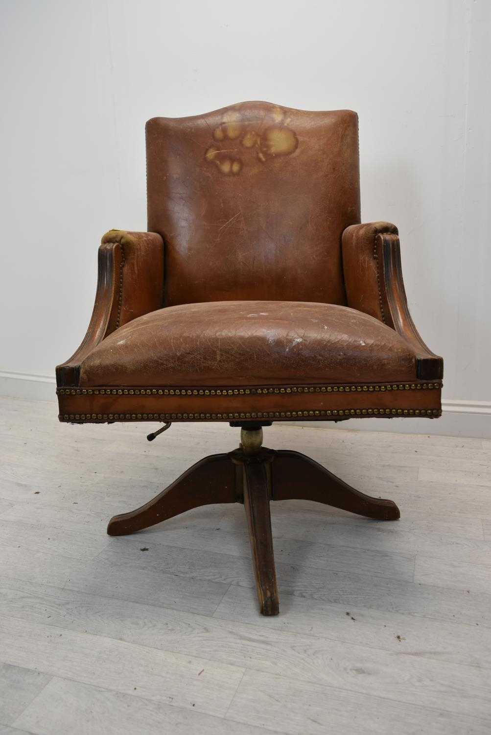 Captain's desk chair, leather upholstered swivel and tilt action. H.103 cm.