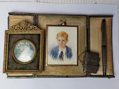 Two 19th century watercolour miniature portraits, one of a young boy in leather case and a silver ve