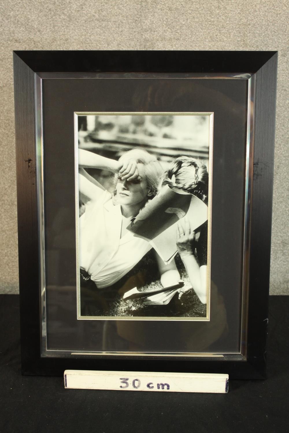 A framed black and white photograph of Marilyn Monroe partially covering her face. H.61 W.47cm. - Image 3 of 4