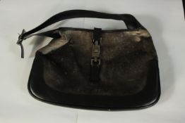 Gucci. Black leather handbag. (Faded). 22 x 32 cm.