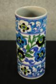 An Islamic hand decorated floral patterned vase. 20cm high.
