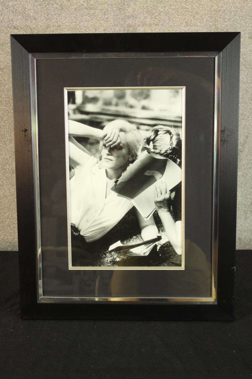 A framed black and white photograph of Marilyn Monroe partially covering her face. H.61 W.47cm. - Image 2 of 4