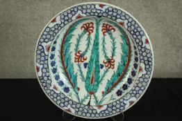 Hand decorated plate. Signed on the back by Ozel Olarak and dated 2006. Diameter of 33 cm.
