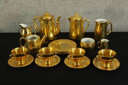A 1930s Royal Winton for Grimwades gold resist part teaset together with one similar. H.20cm. (