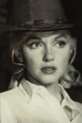 A framed black and white photograph of Marilyn Monroe. H.61 W.47cm.