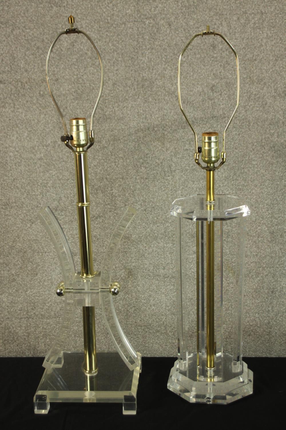 Two Lucite clear perspex lamps. Mid twentieth century. H.77cm (largest).