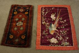 An early 20th century Japanese silk embroidery of an ornamental pheasant in a cherry blossom tree