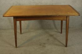 Dining table, mid century teak with maker's label. H.77 W.145cm.