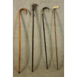 Two sword sticks and two walking canes. The two swords with steel blades. Probably Victorian. H.93cm