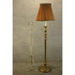 a wrought iron floor lamp set with two iron candle holder along with a vintage carved gilt lamp