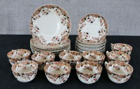 A collection of Chapman ceramics. A tea set and plates. Gilded floral decoration. H.19 cm largest.