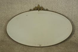 Wall mirror, early 20th century brass framed with bevelled plate. H.45 W.69cm.
