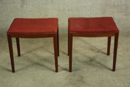 Two stools. Mid century, made from teak and upholstered in red fabric. 46 cm high.