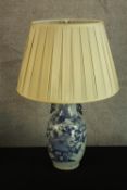 A 19th century hand painted blue and white Chinese vase converted into a table lamp decorated with