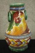 A hand painted ceramic vase. Signed indistinctly on the base. H.41cm.