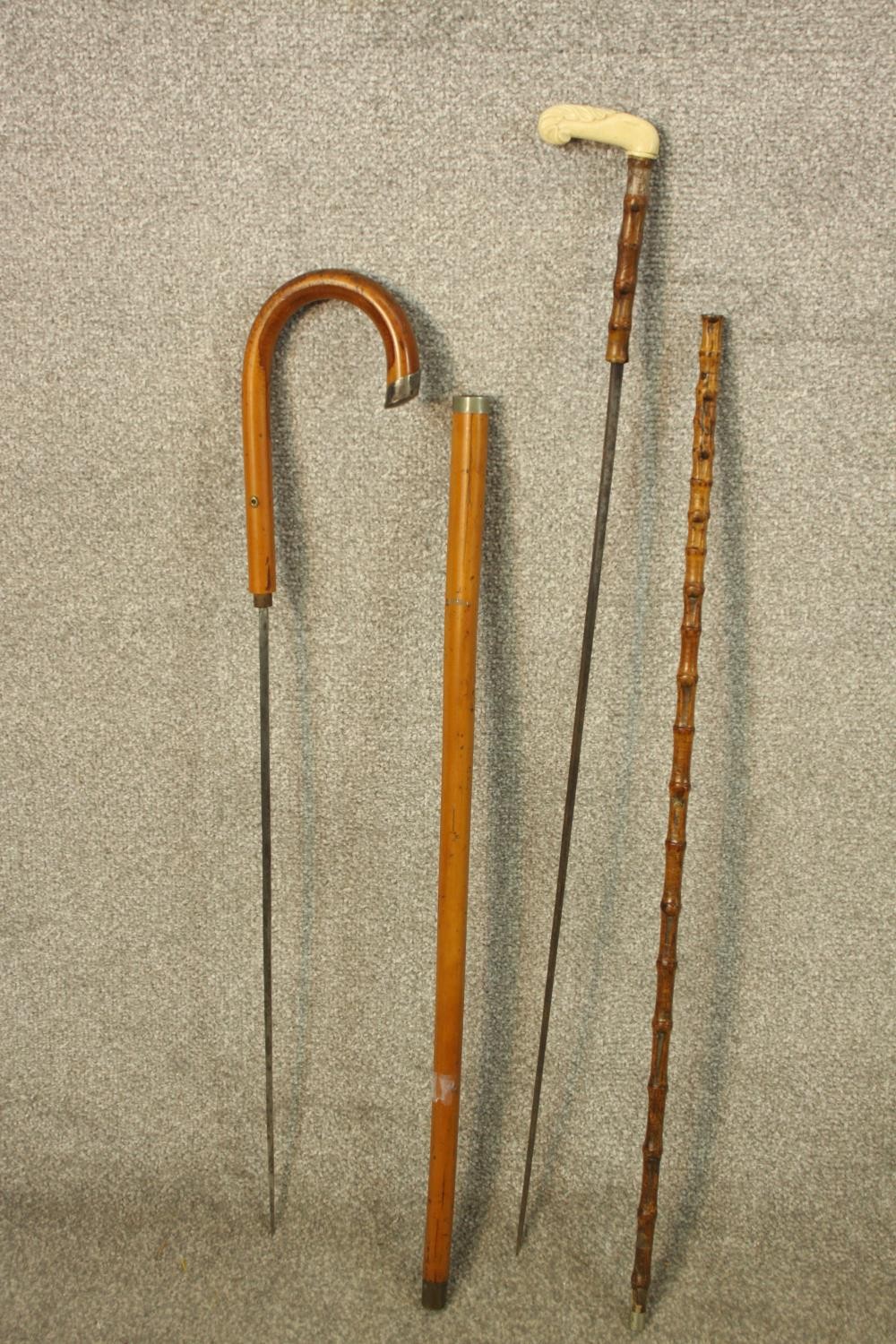 Two sword sticks and two walking canes. The two swords with steel blades. Probably Victorian. H.93cm - Image 3 of 3