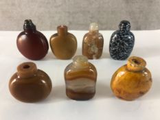 A collection of seven 20th century carved agate, hardstone and glass Chinese snuff bottles, some