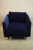 A contemporary blue upholstered angular tub chair. H.83 W,87 D.90cm.
