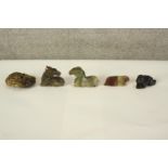 A collection of five Chinese jade, soapstone and hardstone carvings, including a horse, a ram, a