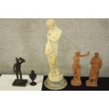 Five reproduction ancient Greek or Roman statues. The largest of the five, Venus, is made from