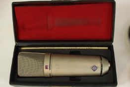 Neumann U87 microphone and stand. Circa 1975 but possibly earlier. Complete with its padded box,