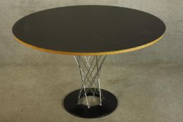 After Isamu Noguchi (1904-1988), A "Cyclone" dining table, laminate top and chrome steel rods on