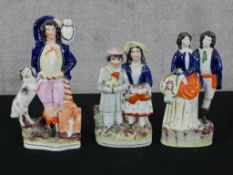 Three Victorian Staffordshire flat back figure groups. One showing a man and spaniel. The largest