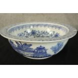 A blue and white decorated ceramic basin. Probably late Victorian. With a light chip in the rim.