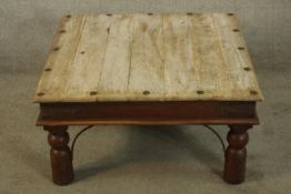 Coffee table, Indian teak and iron. H.40 W.80cm.