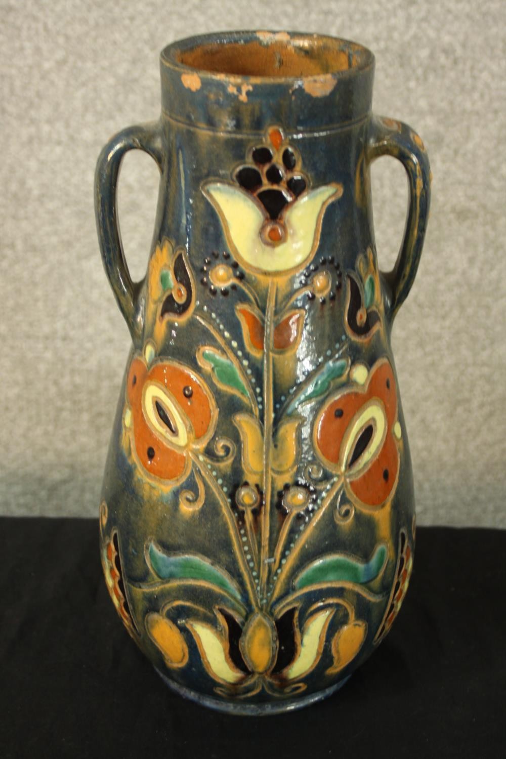 Three studio pottery jugs. Two with a floral decoration. H.30cm (largest). - Image 2 of 5