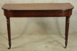 Console table, early 19th century mahogany with ebony inlay. H.72 W.122cm.