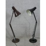 Two anglepoise lamps. Brown and black and both with weighted bases. With labels reading 'Made in