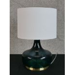 Contemporary table lamp made from green glass with gilded base. H.38 x W.25 cm.